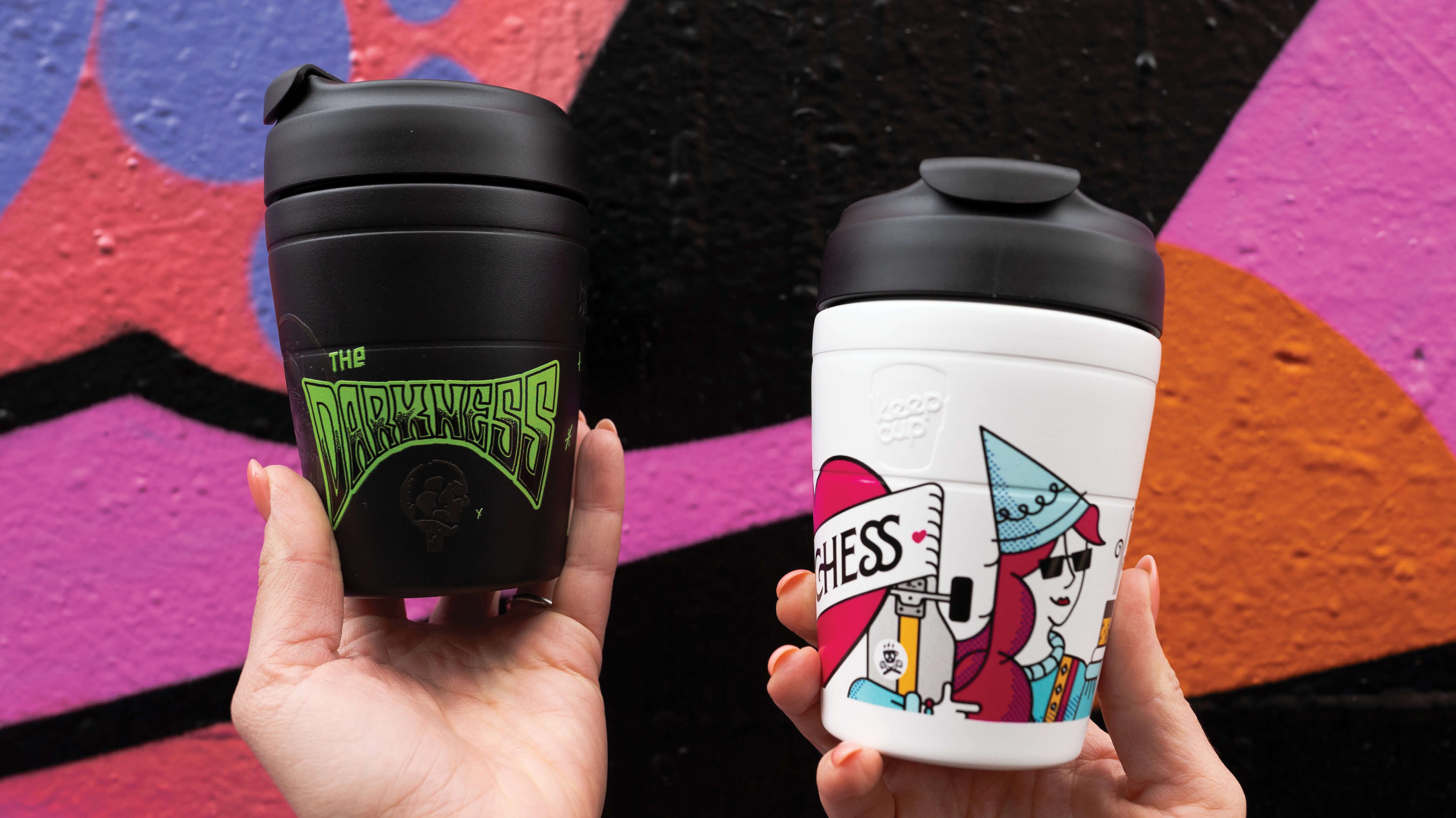 Duchess and Darkness Reusable Coffee Cups Held Up