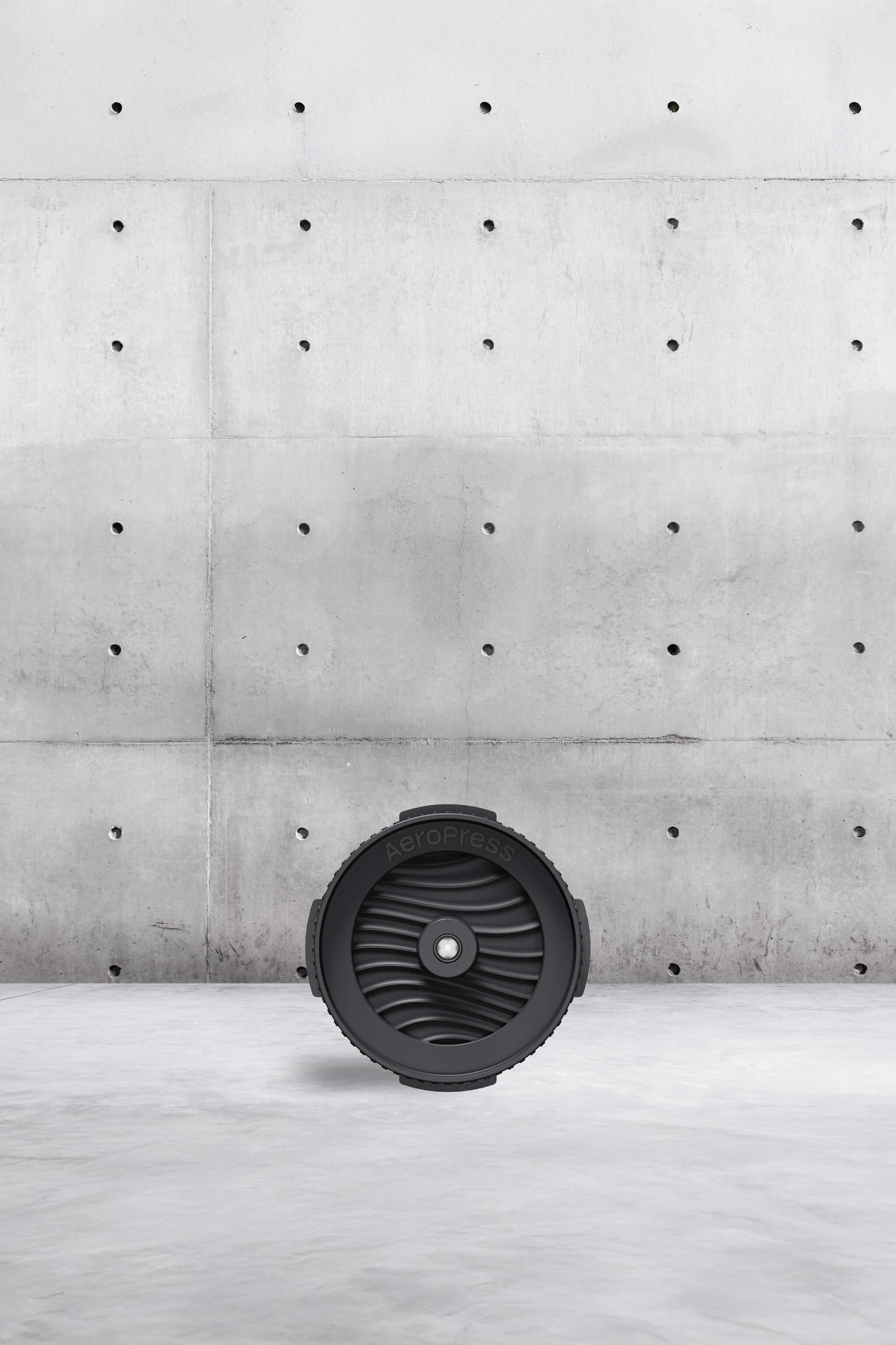 Black cap on a light grey surface