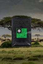 Bag of coffee on Kenyan landscape background