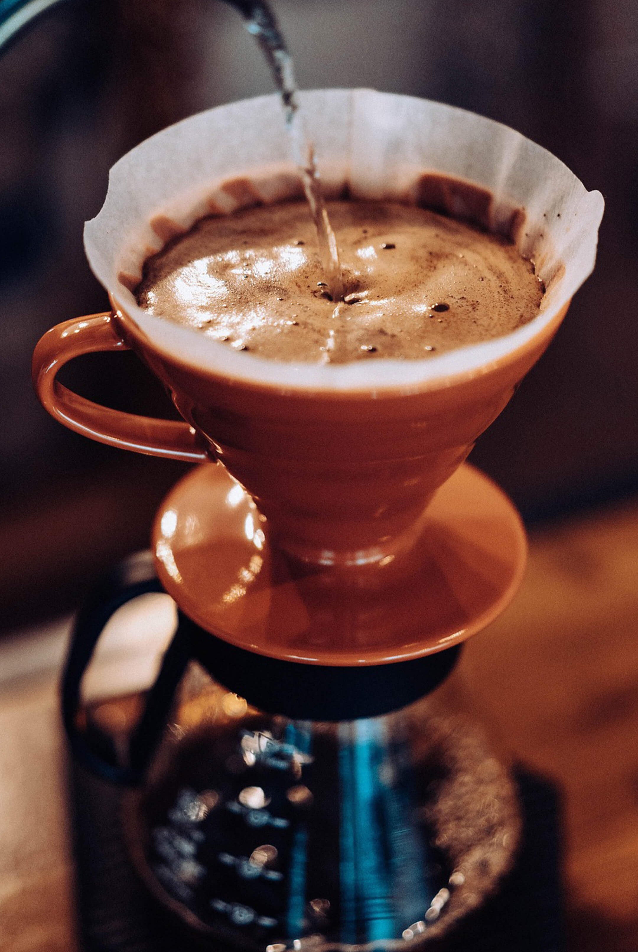 pouring water into pourover coffee