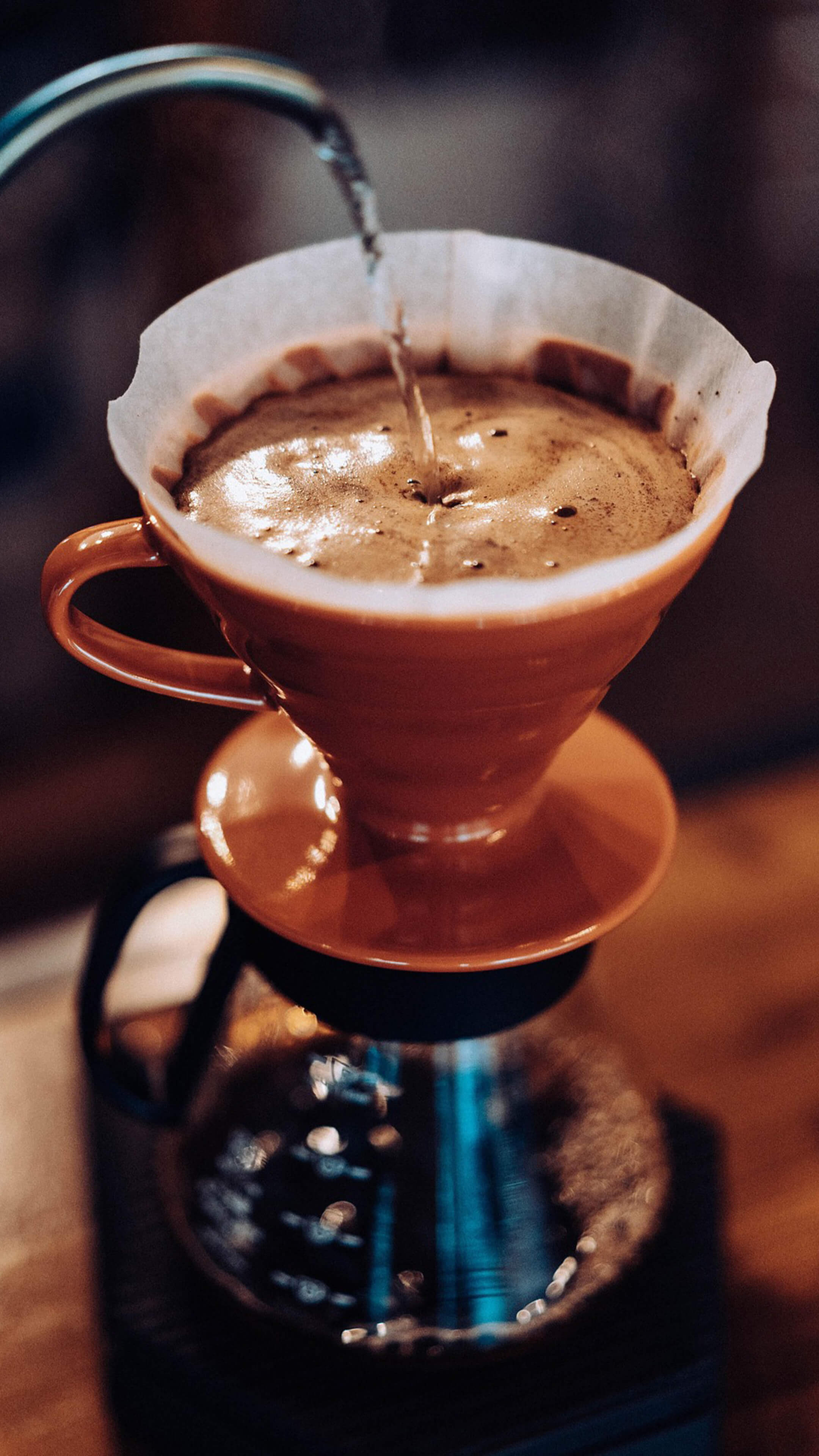 pouring water into pourover coffee