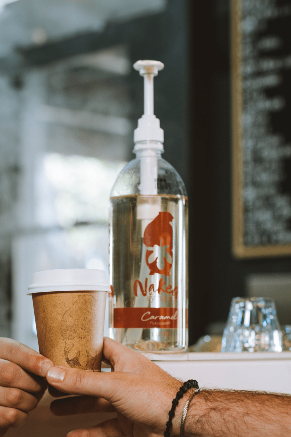 Naked Syrups Bottle on Cafe Bench