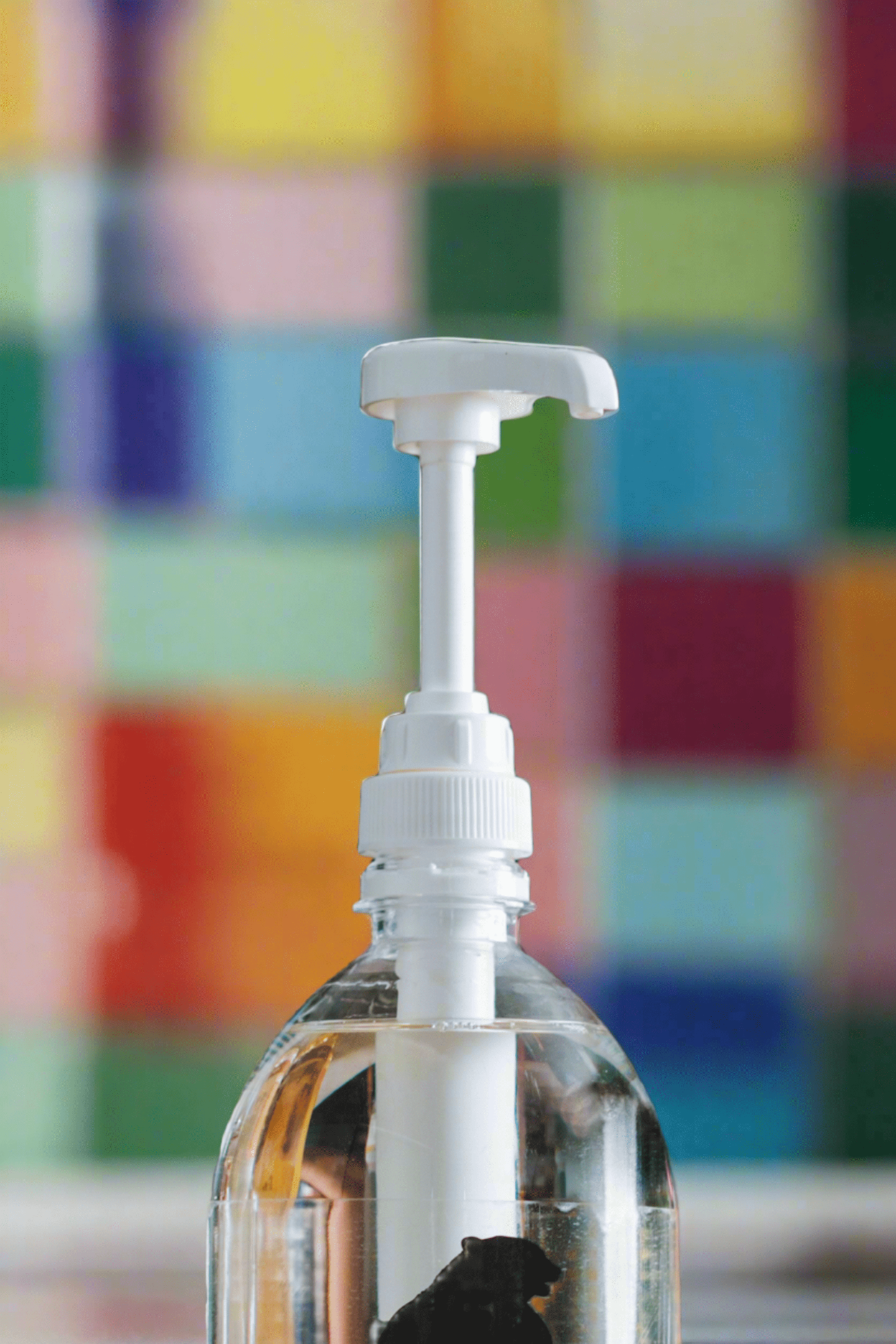 pump dispenser on a colourful background