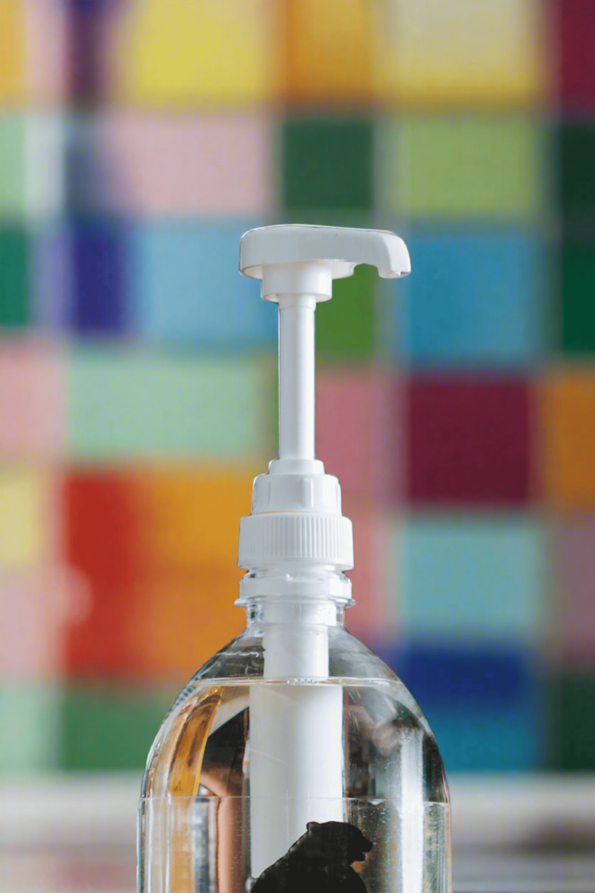 Naked Syrups Pump dispenar on a colourful background