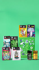Collection of colourful coffee packs and jars on a green background